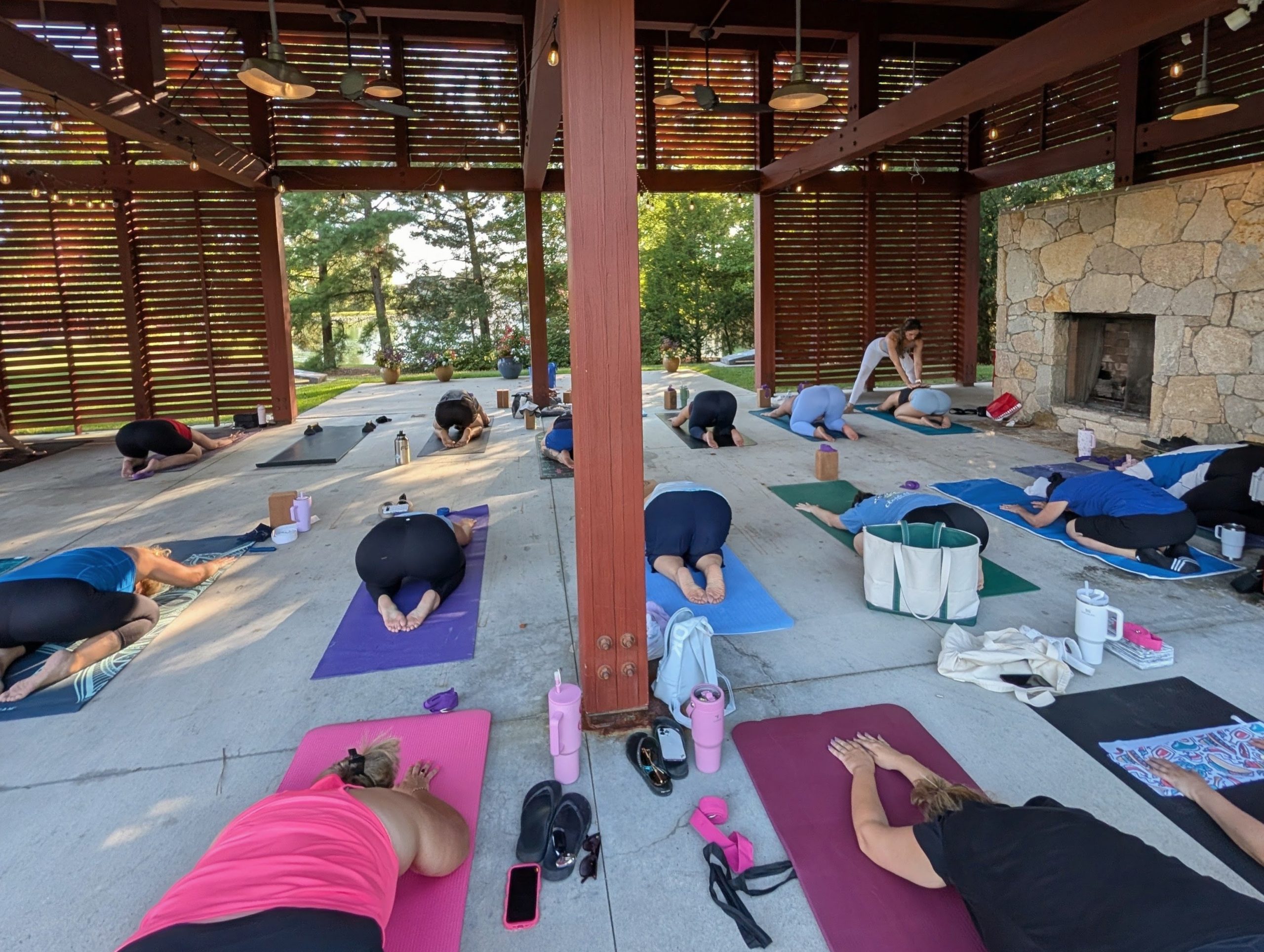 All-levels Vinyasa yoga class in child's pose in Wendell, NC.